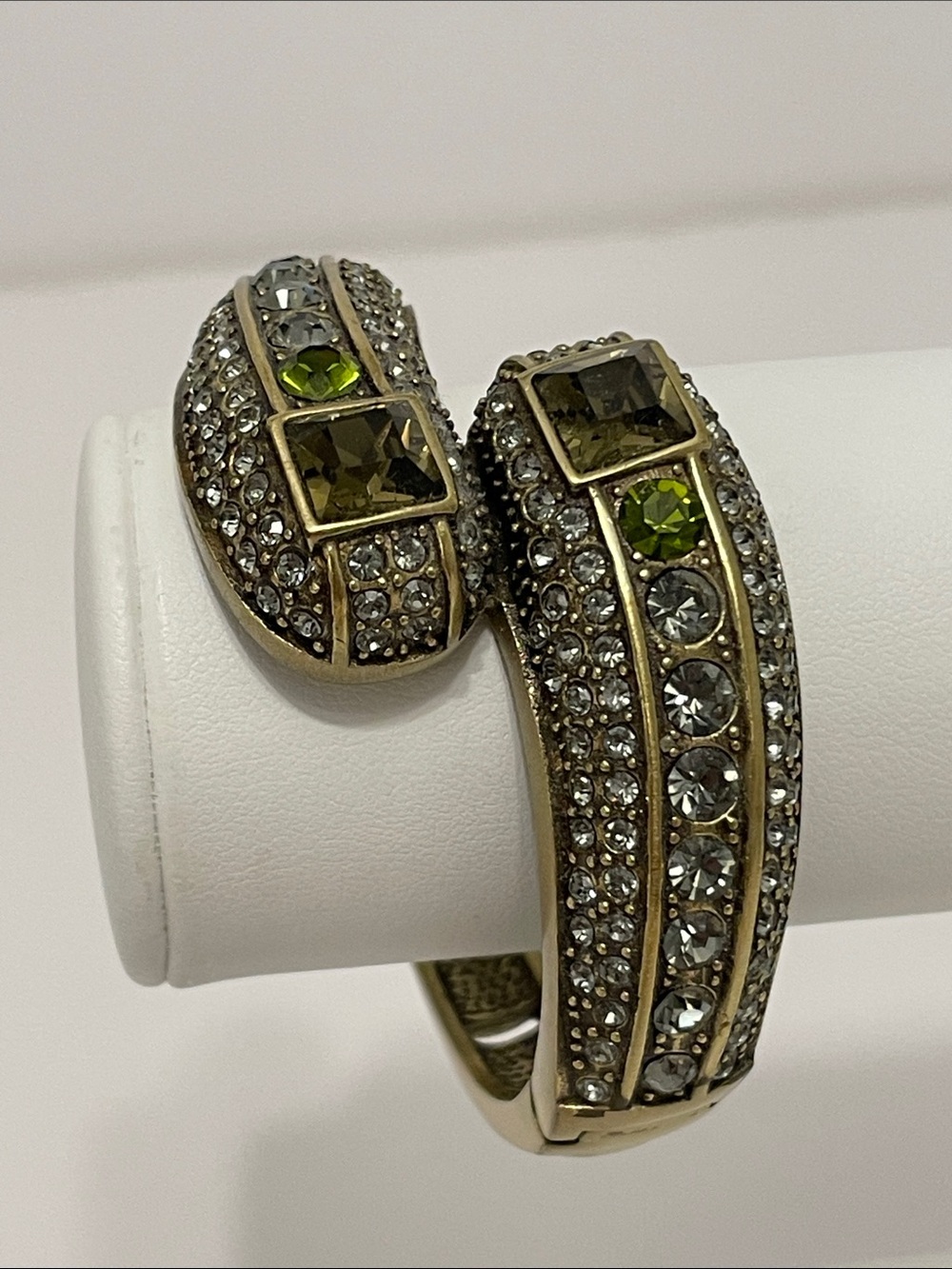 Heidi Daus “Infinite Magic” Oval Olivine/Green Crystal Bypass Hinge Bangle